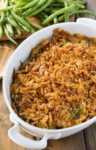 Cheesy Green Bean Casserole that is made from fresh green beans with sautéed mushrooms and a crunchy fried onion topping