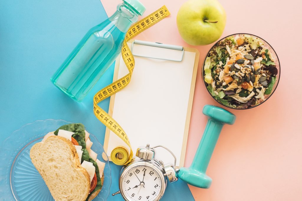 Food with Tape Measure and Alarm Clock to Weight Loss