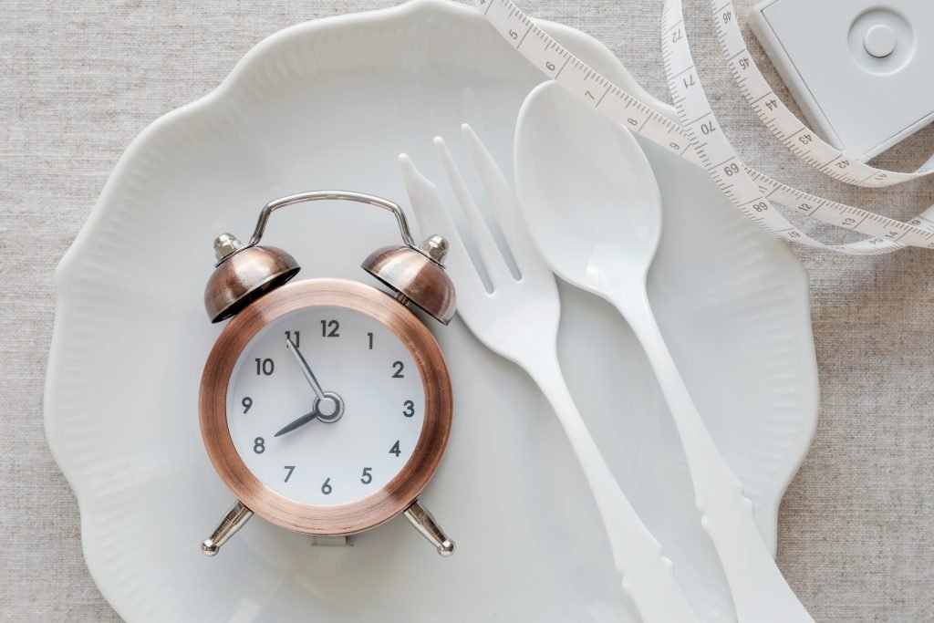 A clock on the plate and tape measure